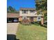 Charming two-story home with well-manicured lawn, brick accents, and an attached garage at 5516 Northwood Dr, Hickory, NC 28601
