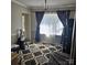 Bright living room with decorative rug, chandelier, and natural light filtering through window at 5516 Northwood Dr, Hickory, NC 28601