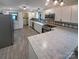 Spacious kitchen featuring white cabinets, stainless steel appliances, and granite counters at 5680 Hillsdale St, Fort Lawn, SC 29714
