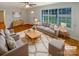 Bright living room with large window and a modern neutral decor at 5680 Hillsdale St, Fort Lawn, SC 29714