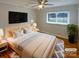 Tranquil bedroom featuring a ceiling fan, a window, and a TV at 5680 Hillsdale St, Fort Lawn, SC 29714