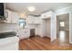 Bright kitchen featuring white cabinets and stainless steel appliances at 6007 Charing Pl, Charlotte, NC 28211