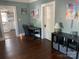 Interior view of space, including a desk and view into kitchen at 604 Pearl Ave, Kannapolis, NC 28083