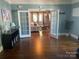 Spacious living room with hardwood floors, view of living room furniture, and a view to another room at 604 Pearl Ave, Kannapolis, NC 28083