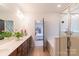 Bathroom features double sink vanity and a shower over tub at 605 Lumber Ln, Charlotte, NC 28214