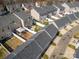 Aerial view of townhomes with backyard patios and white fences at 6830 Colonial Garden Dr, Huntersville, NC 28078