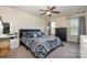 Spacious bedroom featuring a ceiling fan, lots of natural light, and a well-coordinated color scheme at 6830 Colonial Garden Dr, Huntersville, NC 28078