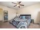 A primary bedroom features carpet, a ceiling fan, and a large closet at 6830 Colonial Garden Dr, Huntersville, NC 28078