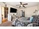 A primary bedroom features a ceiling fan, TV, and an ensuite bath with glass enclosed shower at 6830 Colonial Garden Dr, Huntersville, NC 28078