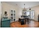 Casual dining area with table, bench, and chairs, adjacent to the kitchen at 6830 Colonial Garden Dr, Huntersville, NC 28078