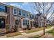 Attractive townhomes with a blend of brick and siding exteriors, with well-kept lawns and appealing facades at 6830 Colonial Garden Dr, Huntersville, NC 28078