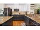 Modern kitchen featuring stainless steel appliances, granite countertops, and ample cabinet space at 6830 Colonial Garden Dr, Huntersville, NC 28078
