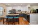 Kitchen with stainless steel appliances, granite countertops, and a center island with bar stool seating at 6830 Colonial Garden Dr, Huntersville, NC 28078