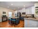 Kitchen with a large center island, stainless steel appliances, and stylish countertops at 6830 Colonial Garden Dr, Huntersville, NC 28078