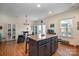 Kitchen featuring a central island, stainless steel appliances, and a casual dining space at 6830 Colonial Garden Dr, Huntersville, NC 28078