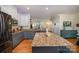 The kitchen features granite countertops, stainless steel appliances, and an open concept design at 6830 Colonial Garden Dr, Huntersville, NC 28078
