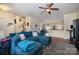 Comfortable living area with a large sectional couch, and an open view of the dining area at 6830 Colonial Garden Dr, Huntersville, NC 28078