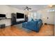 Open living room with sleek flooring, neutral walls, and a large window offering natural light at 6830 Colonial Garden Dr, Huntersville, NC 28078