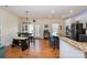 Bright living space connecting the kitchen and dining area, ideal for gathering at 6830 Colonial Garden Dr, Huntersville, NC 28078