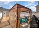 Cozy backyard patio featuring a covered gazebo with seating and a grill for outdoor cooking and gatherings at 6830 Colonial Garden Dr, Huntersville, NC 28078