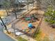 Aerial view of community playground with swings, slides, and seating areas at 6830 Colonial Garden Dr, Huntersville, NC 28078