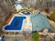 Overhead shot of a community pool and recreation area with a building at 6830 Colonial Garden Dr, Huntersville, NC 28078