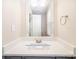 This bathroom features a vanity with a white countertop and stainless steel fixtures at 8137 Sheringham Way, Charlotte, NC 28227