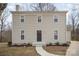 Two-story home featuring neutral siding, a dark front door, and a simple walkway leading to the entrance at 8137 Sheringham Way, Charlotte, NC 28227