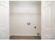 The laundry room features white walls, wood grain floors, and hookups at 8137 Sheringham Way, Charlotte, NC 28227