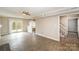 Open living room with sliding glass doors to the deck and carpeted stairs to the upper floor at 8137 Sheringham Way, Charlotte, NC 28227