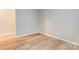 Neutral bedroom features light wood flooring and modern color palette at 830 Wilcrest Ct, York, SC 29745