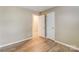 This light, neutral bedroom has wood-look floors and two white doors at 830 Wilcrest Ct, York, SC 29745