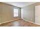 This light, neutral bedroom features a large window and a white paneled door at 830 Wilcrest Ct, York, SC 29745