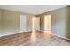 Spacious bedroom featuring wood floors, neutral paint and ensuite bathroom at 830 Wilcrest Ct, York, SC 29745