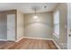 Bright dining room featuring wood floors, neutral paint and a modern light fixture at 830 Wilcrest Ct, York, SC 29745