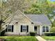 Charming single-story home with well-maintained front lawn, trimmed bushes and black shutters at 830 Wilcrest Ct, York, SC 29745