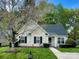 Charming single-story home featuring well-manicured lawn and a welcoming entryway at 830 Wilcrest Ct, York, SC 29745