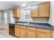 Efficient kitchen featuring stainless appliances, wood cabinetry and view out the back door at 830 Wilcrest Ct, York, SC 29745