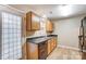 Efficient kitchen featuring stainless appliances, wood cabinetry and view out the back door at 830 Wilcrest Ct, York, SC 29745