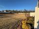 Expansive backyard featuring lush greenery and a fence line, perfect for outdoor activities at 9020 Northfield Crossing Dr, Charlotte, NC 28269
