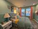 The bedroom is brightly lit with cheerful and fun decor at 9020 Northfield Crossing Dr, Charlotte, NC 28269