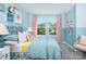 Cheerful bedroom featuring bright blue walls, pink accents, and whimsical decor at 9020 Northfield Crossing Dr, Charlotte, NC 28269