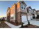 Stunning home exterior featuring a stone facade, a two-car garage, and professional landscaping at 9020 Northfield Crossing Dr, Charlotte, NC 28269
