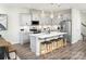 Modern kitchen with gray cabinets, stainless steel appliances, and a center island with bar seating at 9020 Northfield Crossing Dr, Charlotte, NC 28269
