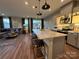 Open-concept space featuring a kitchen with stainless appliances and adjacent living area at 9020 Northfield Crossing Dr, Charlotte, NC 28269