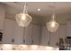 The kitchen features modern pendant lighting at 9020 Northfield Crossing Dr, Charlotte, NC 28269