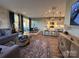 Open-concept living space with a kitchen, dining area, and comfortable living room with decor at 9020 Northfield Crossing Dr, Charlotte, NC 28269