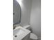 Modern bathroom featuring a sleek sink, faucet, toilet, and a black framed mirror at 101 Colony Acres Dr, Charlotte, NC 28217
