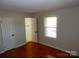 Bedroom with wood floors and a walk-in closet and bathroom at 101 Colony Acres Dr, Charlotte, NC 28217