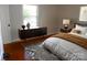 Stylishly decorated bedroom featuring a mid-century modern style console and a decorative rug at 101 Colony Acres Dr, Charlotte, NC 28217